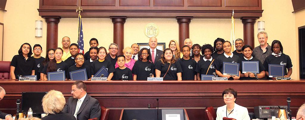 The Monmouth County Board of Chosen Freeholders presented Asbury Park Junior Entrepreneur Training (JET) students with certificates of recognition for participating in the 2015 Made in Monmouth expo in April at their regular public meeting on May 28 in Keyport.